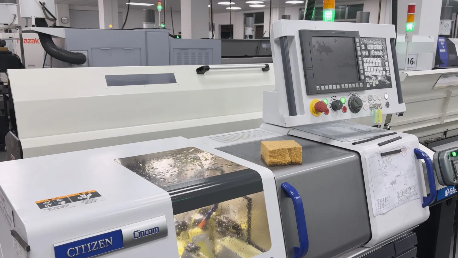 Citizen Cincom R04VI Swiss-type lathe with bar feeder at OUJI